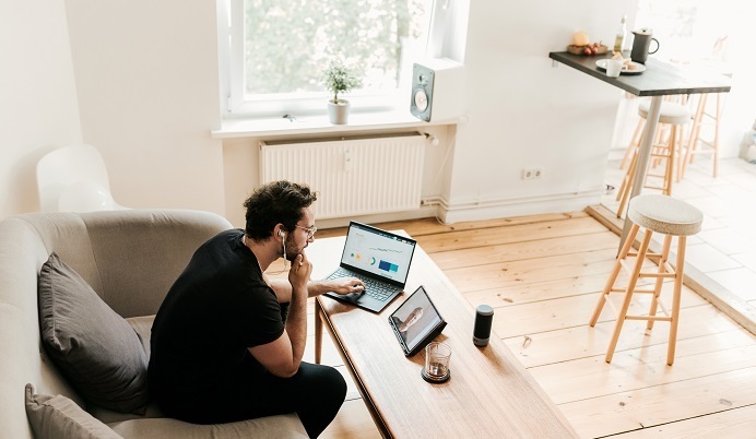 Man working on laptop during virtual call